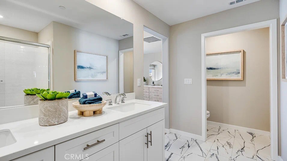 1132 Thunderchief Lane Rialto, CA 92376 - Photo 12 of 19 a bathroom with a sink and a mirror