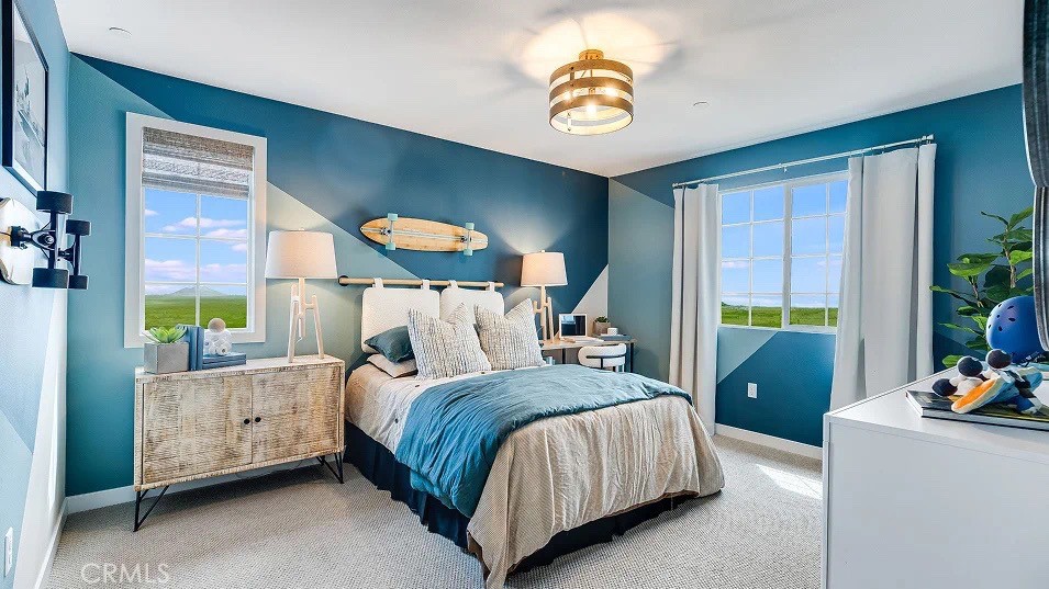 1132 Thunderchief Lane Rialto, CA 92376 - Photo 6 of 19 a bedroom with a bed and a chandelier