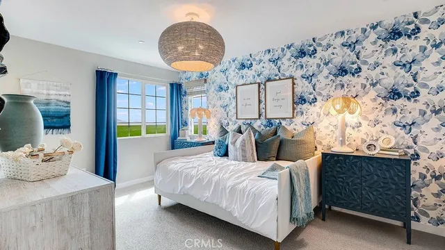 a bedroom with bed and window