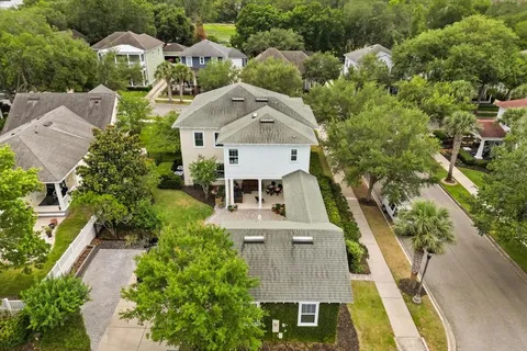 an aerial view of a multi story residential apartment building in front of it