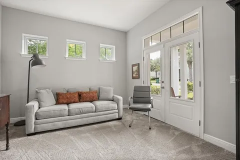 a living room with furniture and a window
