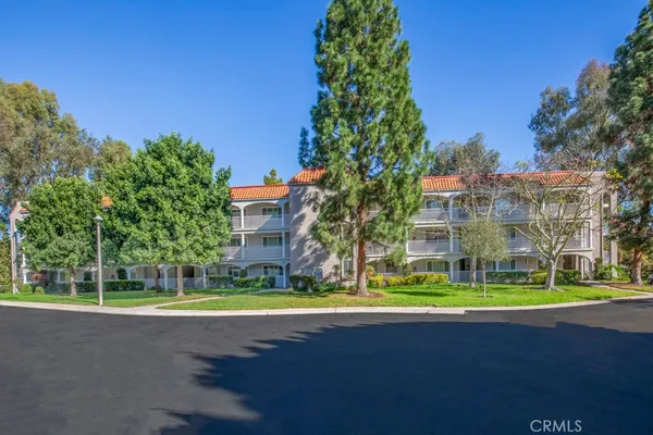 a view of a building with a yard