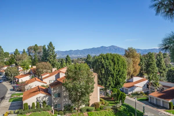 a kitchen with a table chairs refrigerator and dining table