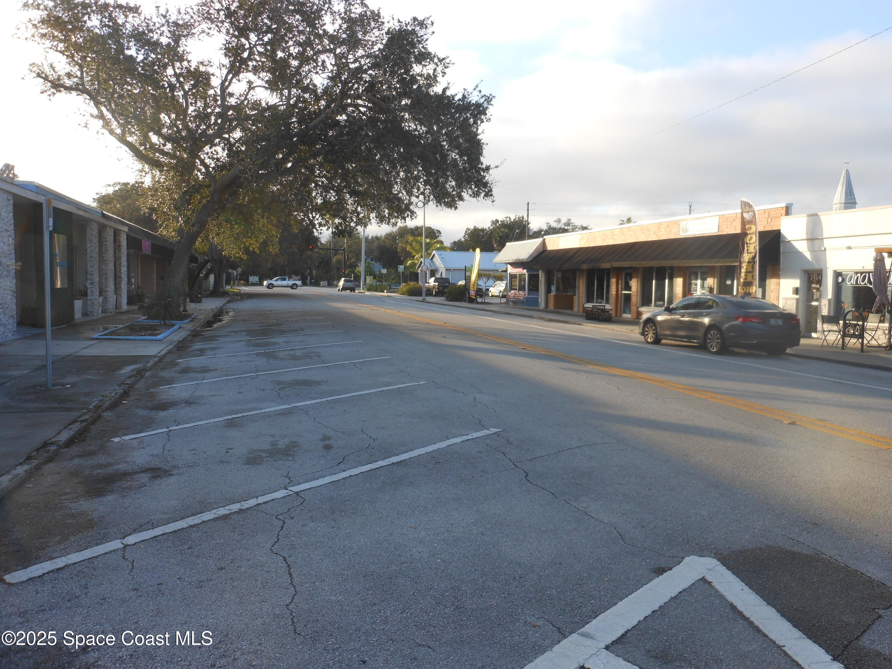 2273 Highland Avenue Melbourne, FL 32935 - Photo 17 of 20 a view of city street with house and trees