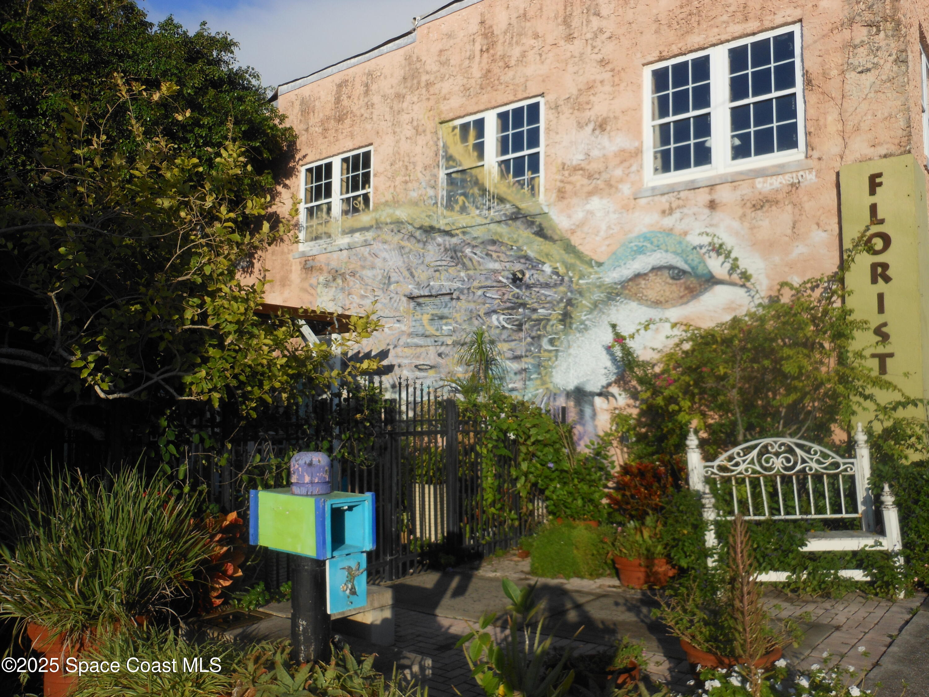 2273 Highland Avenue Melbourne, FL 32935 - Photo 18 of 20 a view of a house with a yard