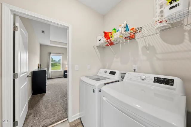 a utility room with dryer and washer
