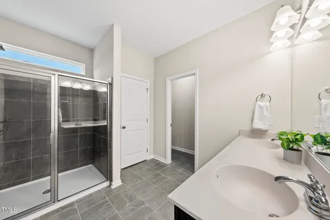 a bathroom with a sink and shower