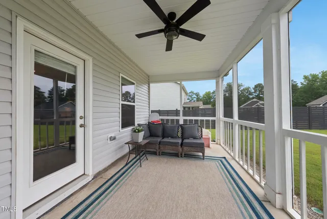 a view of a balcony with furniture