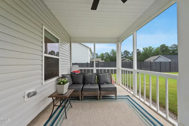 a balcony with chairs