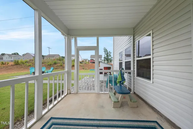 a view of a porch with furniture