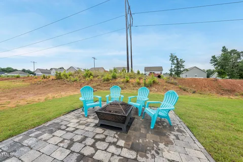 a view of a chairs and table in the patio