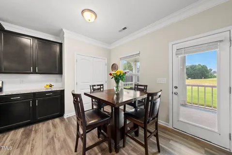 a view of a dining room with furniture window and outside view
