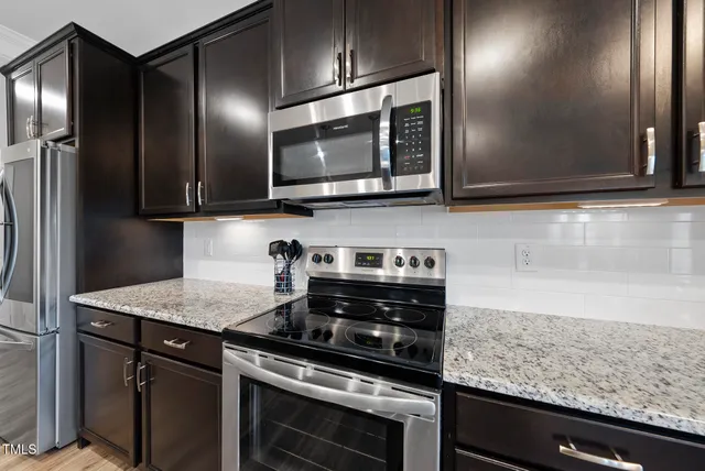 a kitchen with a stove and a microwave