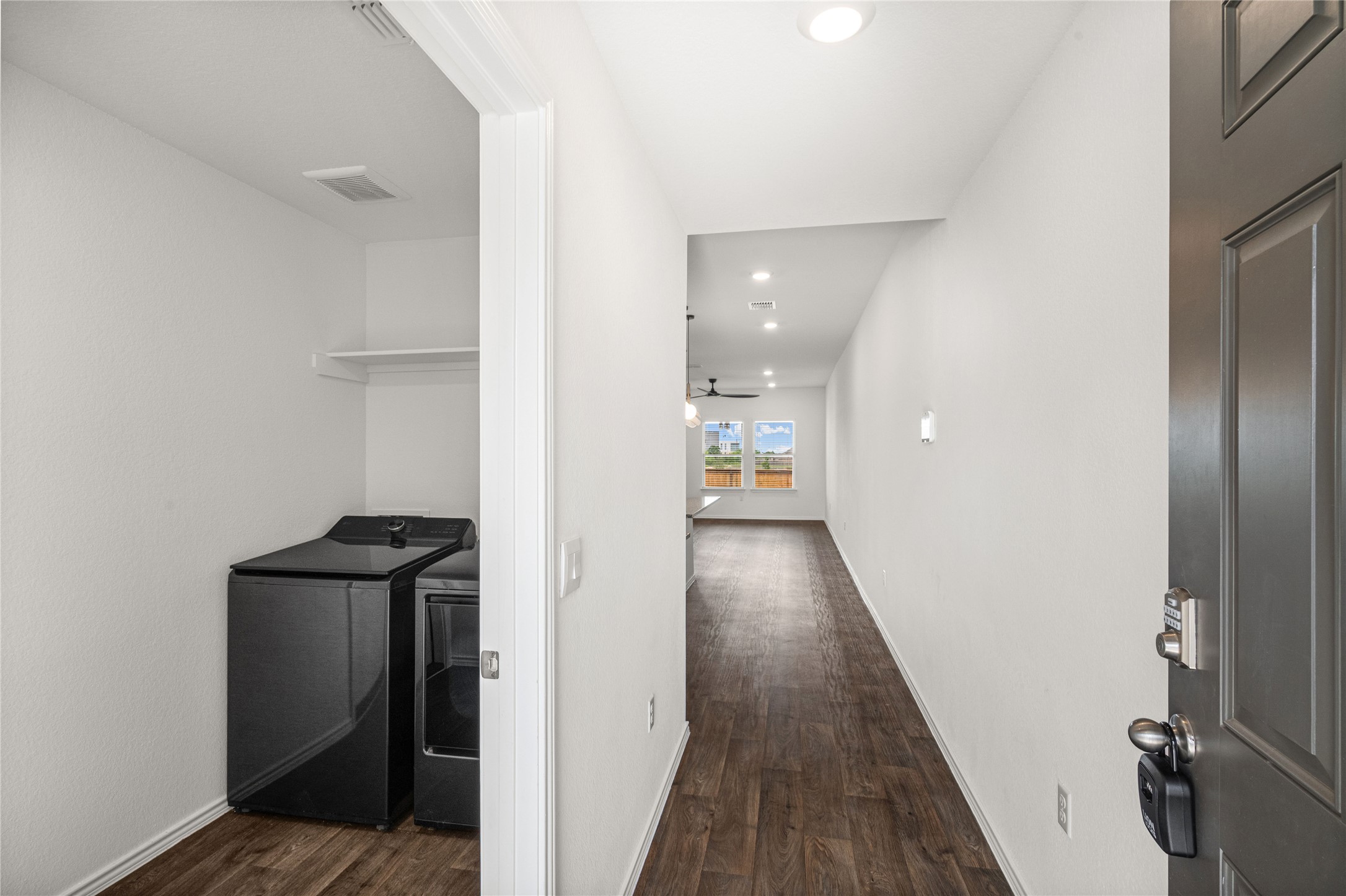 15004 Welsh Cobb Rd Manor, Unit A Manor, TX 78653 - Photo 4 of 22 Entryway featuring wood-finish flooring, recessed lighting, and a laundry area with an overhead shelf