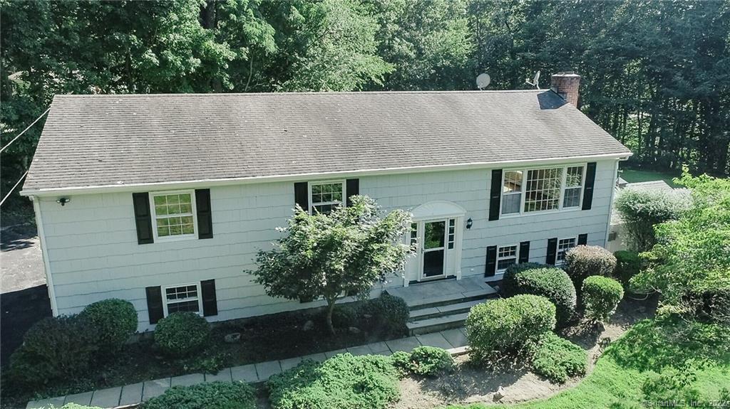 front view of a house with a garden