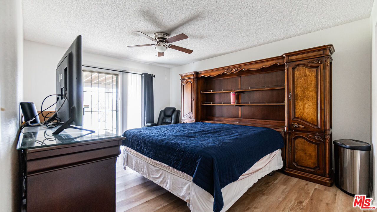 586 San Dimas Street Hemet, CA 92545 - Photo 14 of 30 a bedroom with a bed and a window