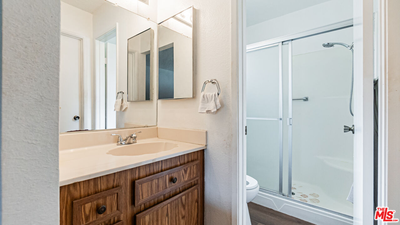 586 San Dimas Street Hemet, CA 92545 - Photo 17 of 30 a bathroom with a sink a toilet and shower