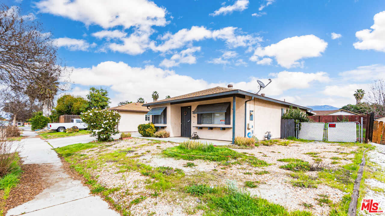 586 San Dimas Street Hemet, CA 92545 - Photo 2 of 30 a front view of a house with a yard