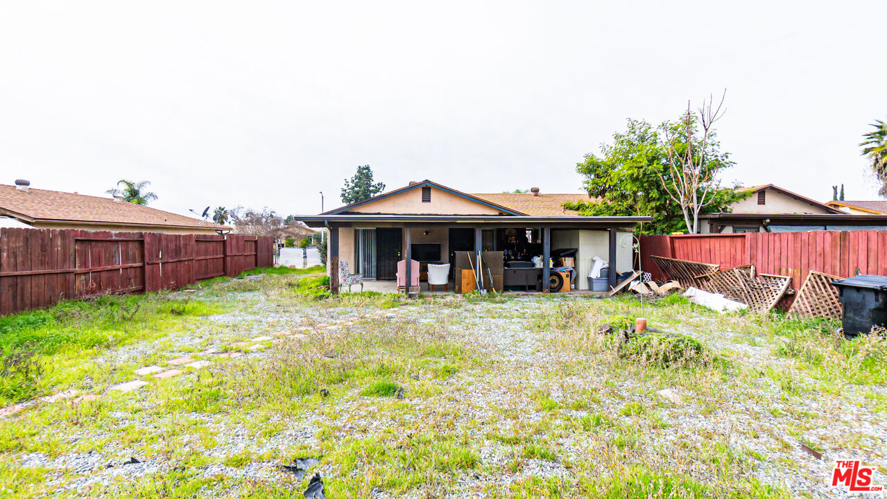 586 San Dimas Street Hemet, CA 92545 - Photo 25 of 30 a front view of a house with garden