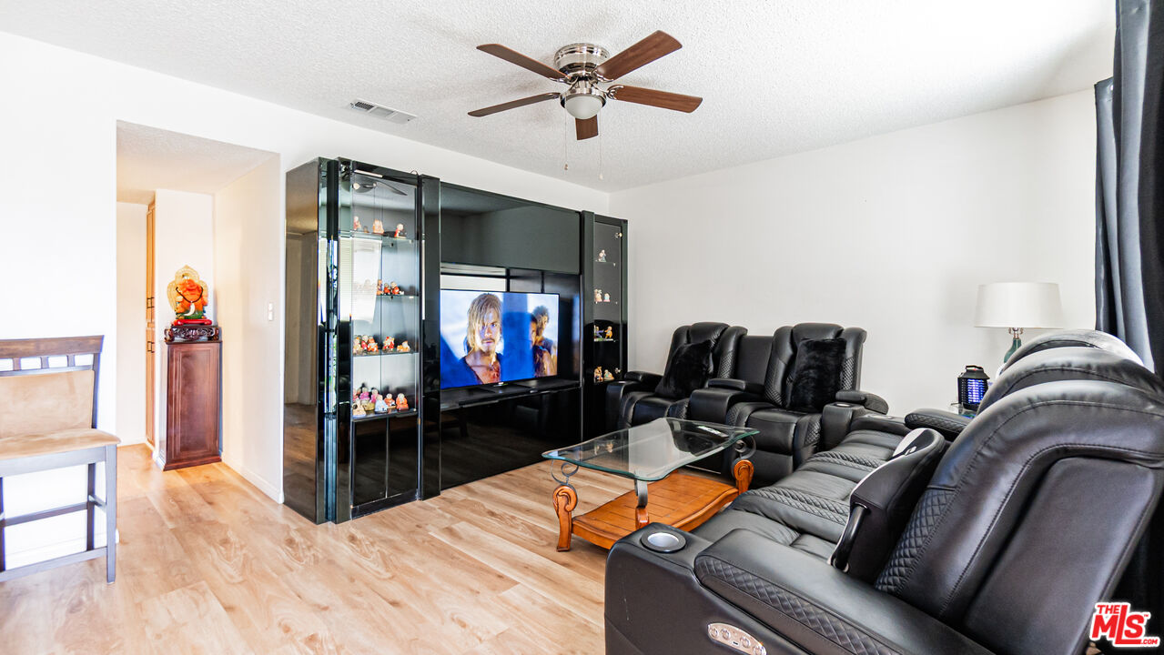 586 San Dimas Street Hemet, CA 92545 - Photo 4 of 30 a living room with furniture and a flat screen tv