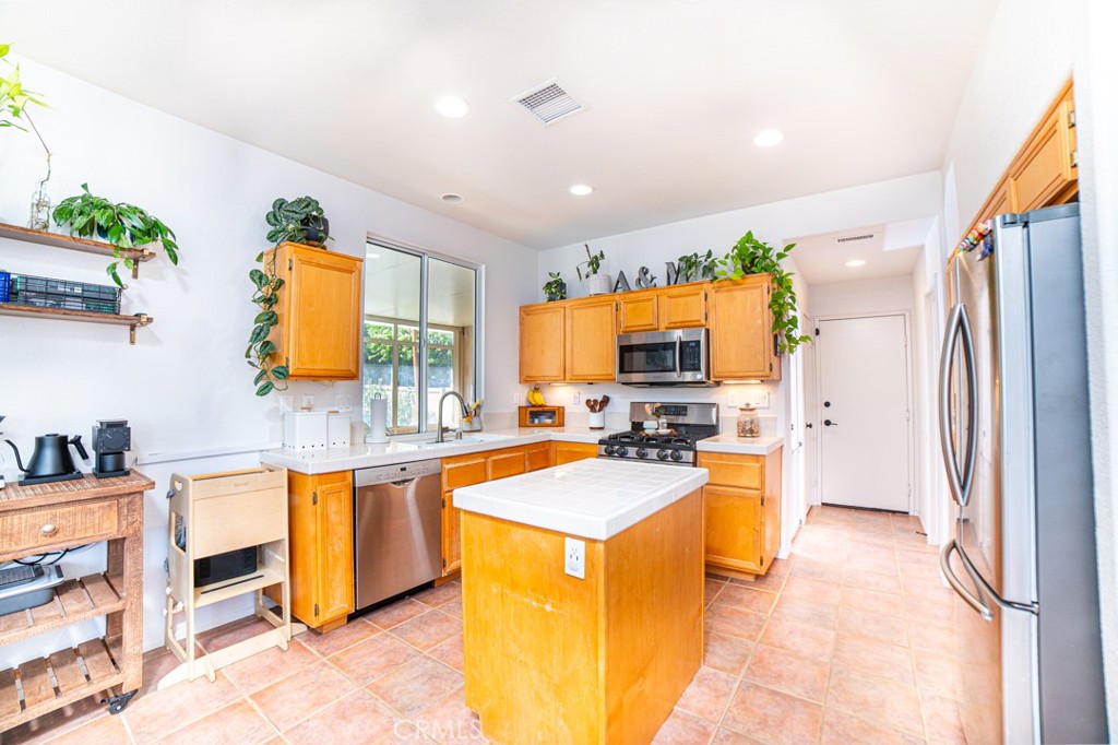 17801 Morning Rock Circle Riverside, CA 92503 - Photo 5 of 18 a kitchen with stainless steel appliances granite countertop a sink stove and refrigerator