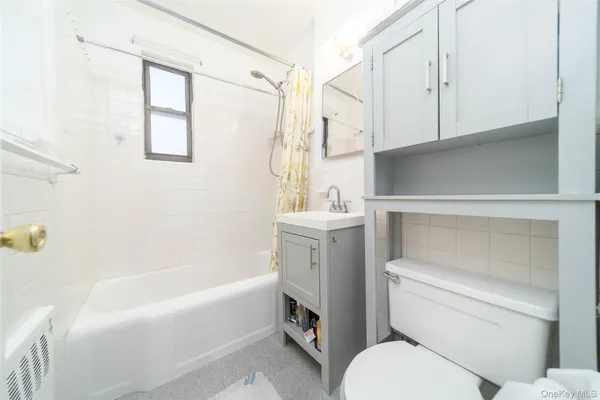 a bathroom with a toilet sink and bathtub