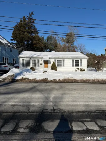 a front view of a house with a lake view
