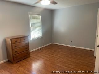 394 Wrench Road Godwin, NC 28344 - Photo 11 of 20 an empty room with wooden floor