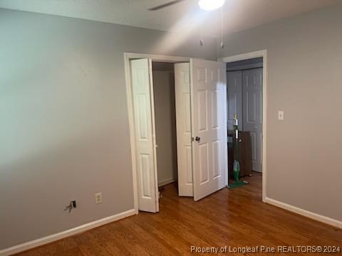 394 Wrench Road Godwin, NC 28344 - Photo 14 of 20 an empty room with wooden floor & closet area
