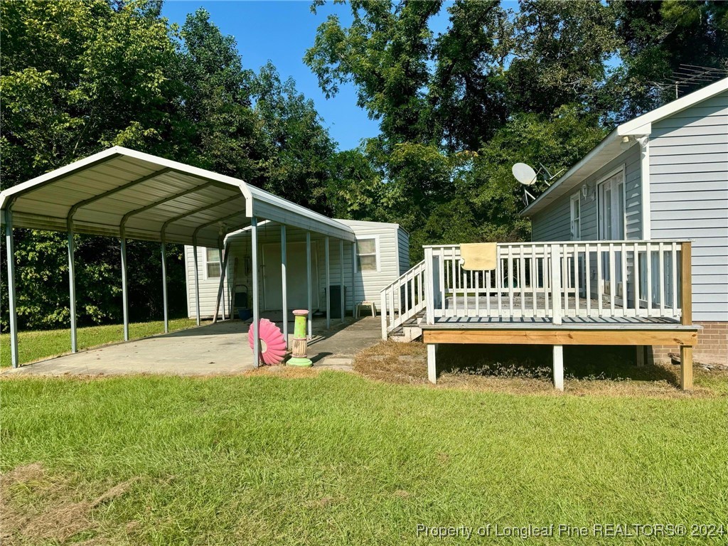 394 Wrench Road Godwin, NC 28344 - Photo 16 of 20 a front view of a house with swimming pool and porch with furniture