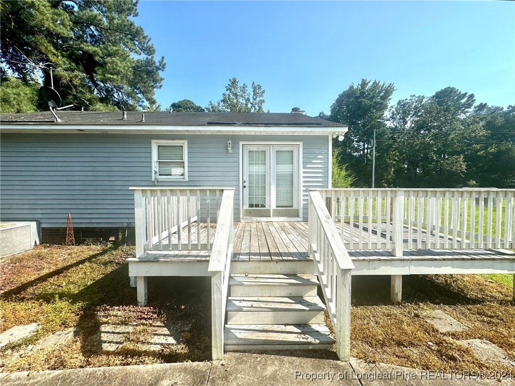 394 Wrench Road Godwin, NC 28344 - Photo 17 of 20 a front view of a house with a balcony