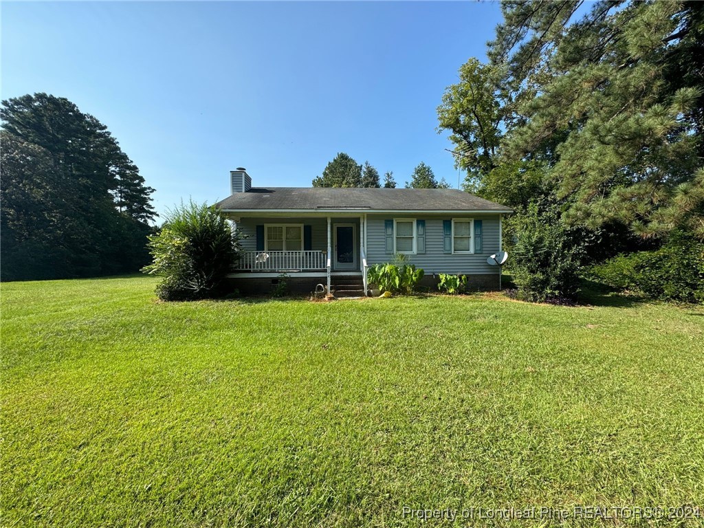 394 Wrench Road Godwin, NC 28344 - Photo 2 of 20 a front view of house with yard and green space