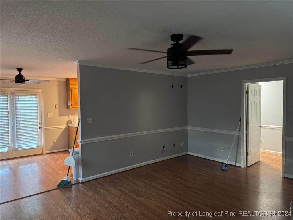 394 Wrench Road Godwin, NC 28344 - Photo 3 of 20 a view of empty room with wooden floor and fan