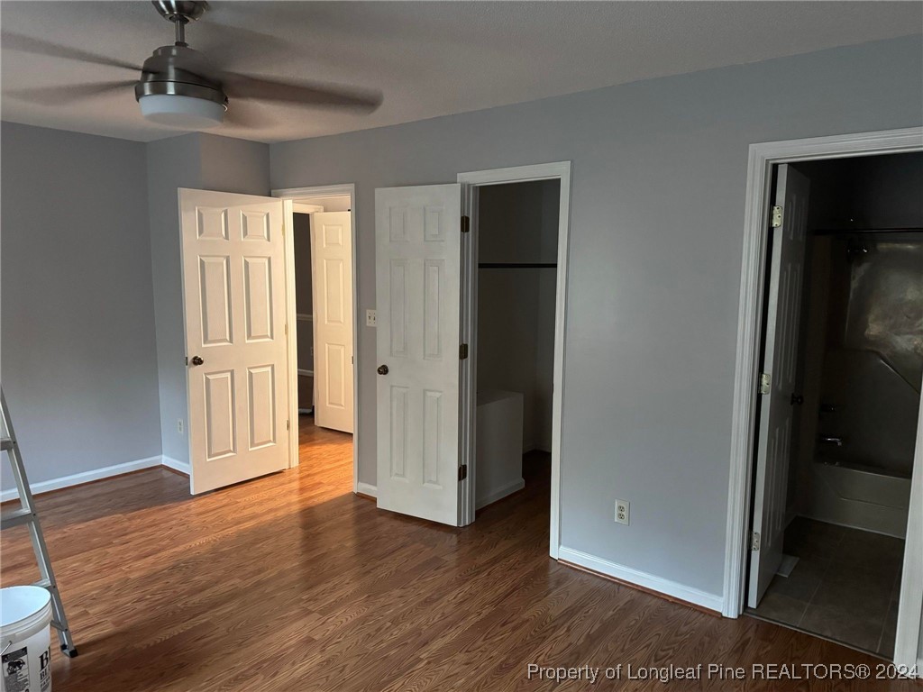 394 Wrench Road Godwin, NC 28344 - Photo 9 of 20 a view of empty room with wooden floor and fan