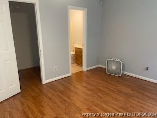 394 Wrench Road Godwin, NC 28344 - Photo 10 of 20 an empty room with wooden floor and windows