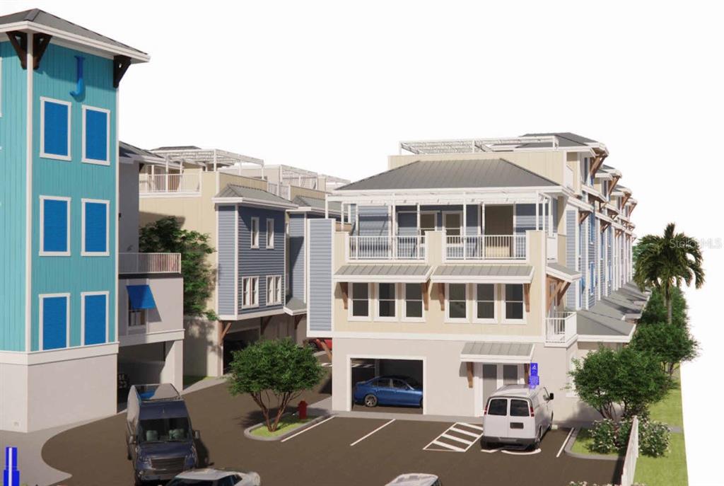 16 Outlook Way, Unit 9 Dunedin, FL 34698 - Photo 18 of 77 a front view of a residential apartment building with a yard