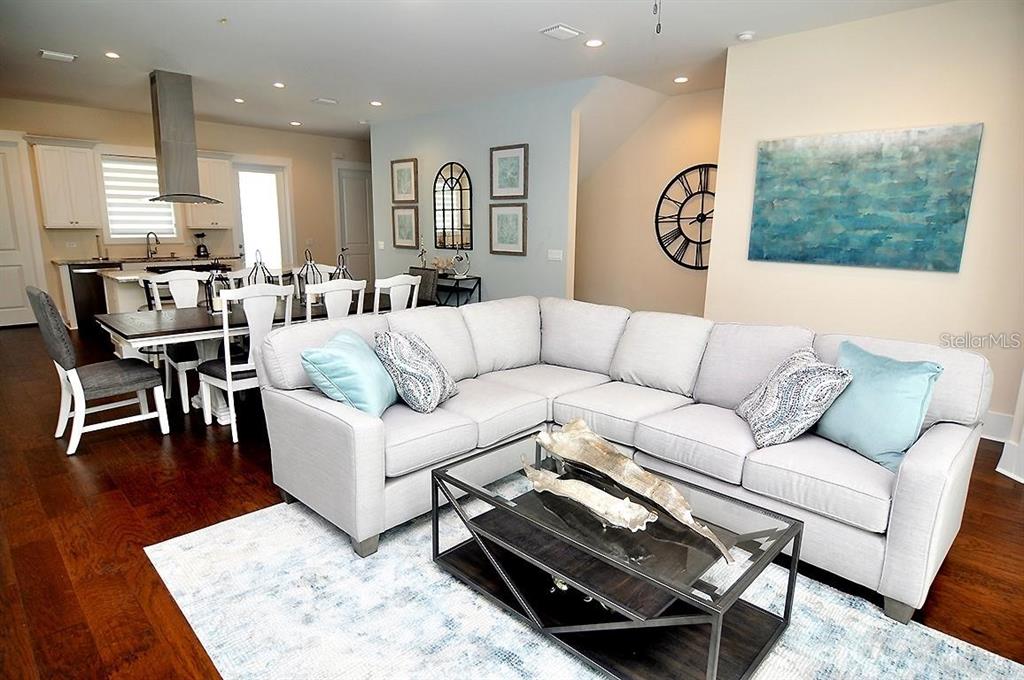 16 Outlook Way, Unit 9 Dunedin, FL 34698 - Photo 38 of 77 a living room with furniture and wooden floor