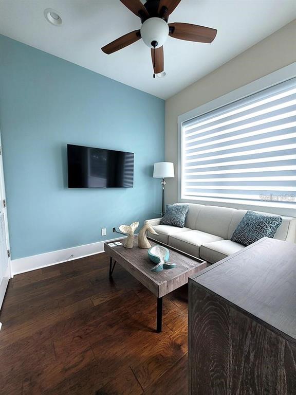 16 Outlook Way, Unit 9 Dunedin, FL 34698 - Photo 41 of 77 a living room with furniture and a flat screen tv