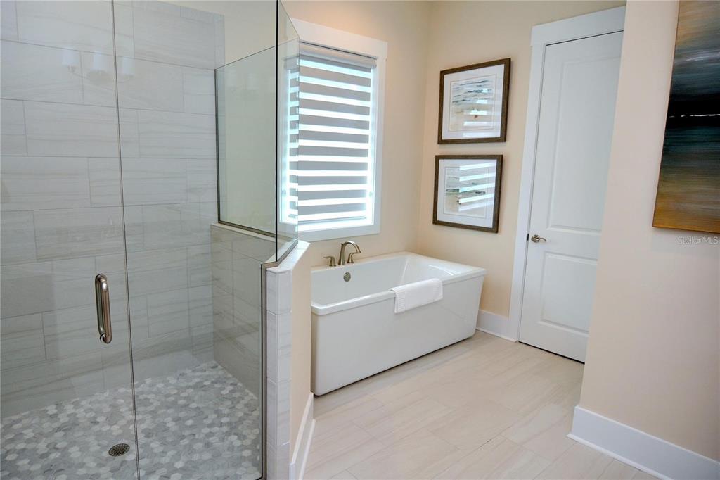 16 Outlook Way, Unit 9 Dunedin, FL 34698 - Photo 55 of 77 a bathroom with a bathtub and shower