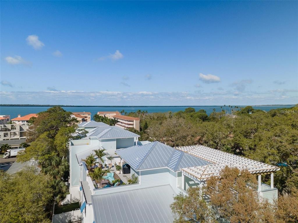 16 Outlook Way, Unit 9 Dunedin, FL 34698 - Photo 63 of 77 an aerial view of residential houses with outdoor space