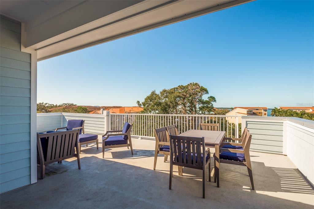 16 Outlook Way, Unit 9 Dunedin, FL 34698 - Photo 76 of 77 a view of a balcony with furniture