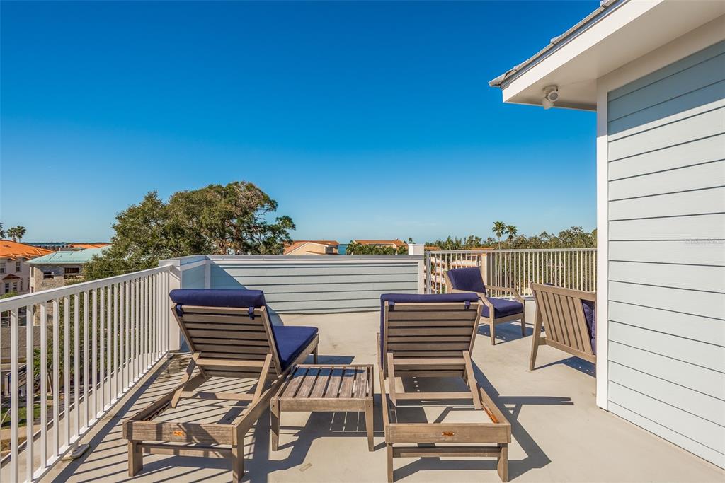 16 Outlook Way, Unit 9 Dunedin, FL 34698 - Photo 77 of 77 a view of a balcony with chairs