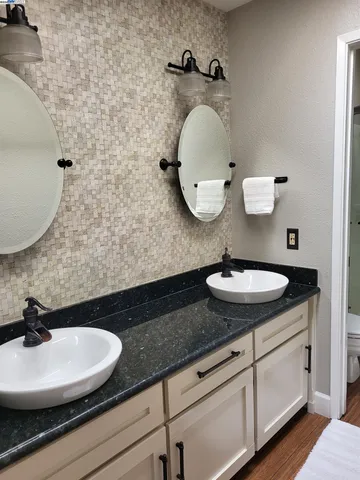 a bathroom with a sink and mirror