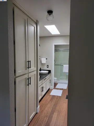 a bathroom with a double vanity sink and mirror