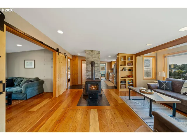 a living room with furniture a table and a flat screen tv