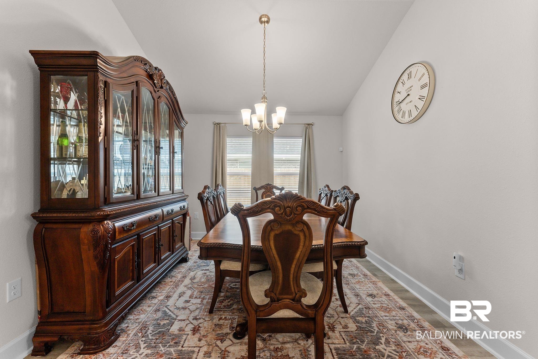 692 Mayflower Drive Foley, AL 36535 - Photo 7 of 40 Dining room featuring lofted ceiling, suspended lighting, and wood finished floors