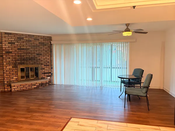 a view of a livingroom with furniture and a fireplace