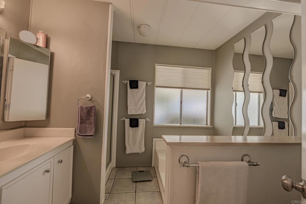 4650 Dulin Road, Unit 27 Fallbrook, CA 92003 - Photo 25 of 37 a bathroom with a sink and a mirror