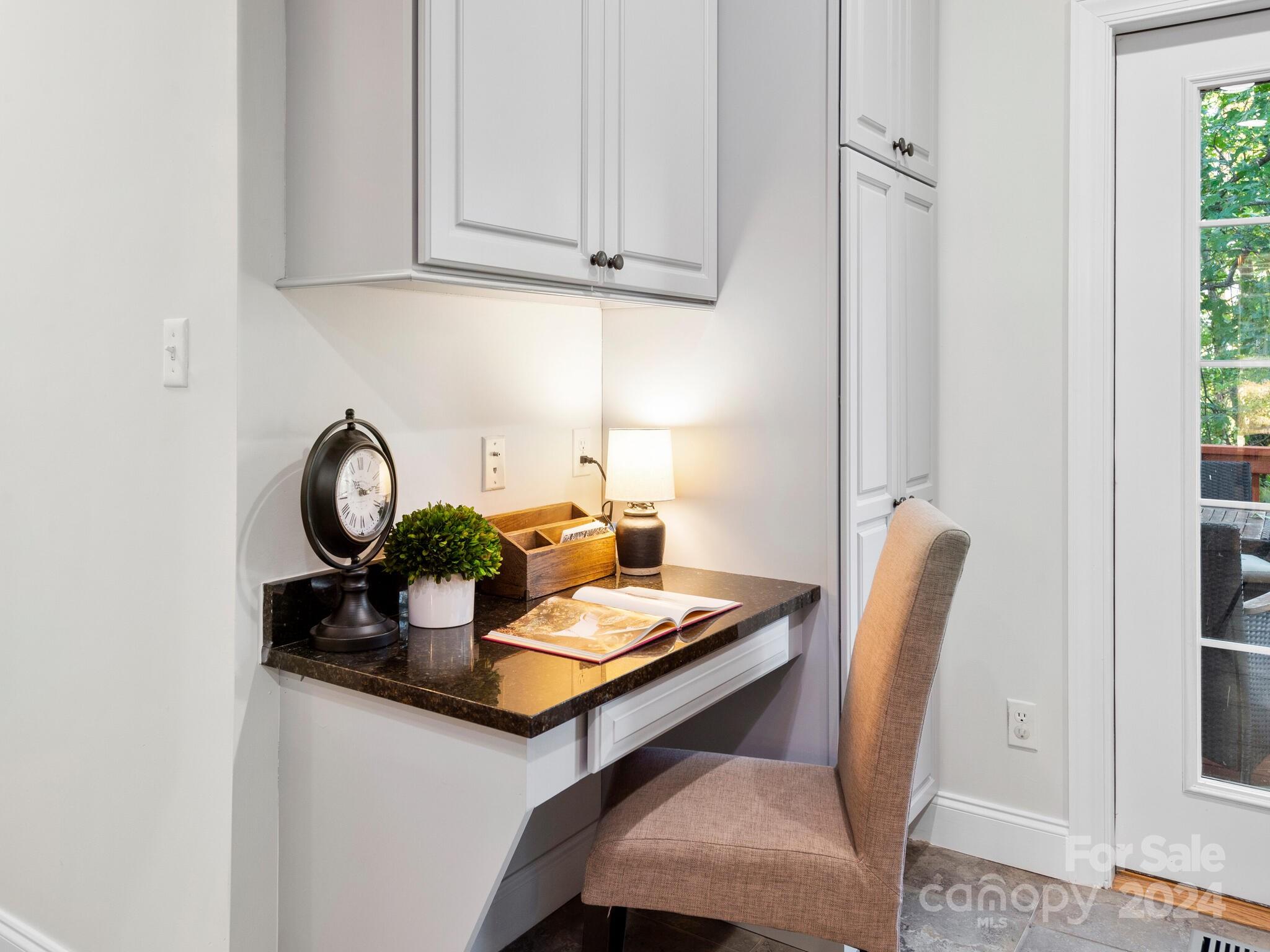 9 Forest Spring Drive Asheville, NC 28804 - Photo 16 of 42 a view of dining room cabinets and wooden floor