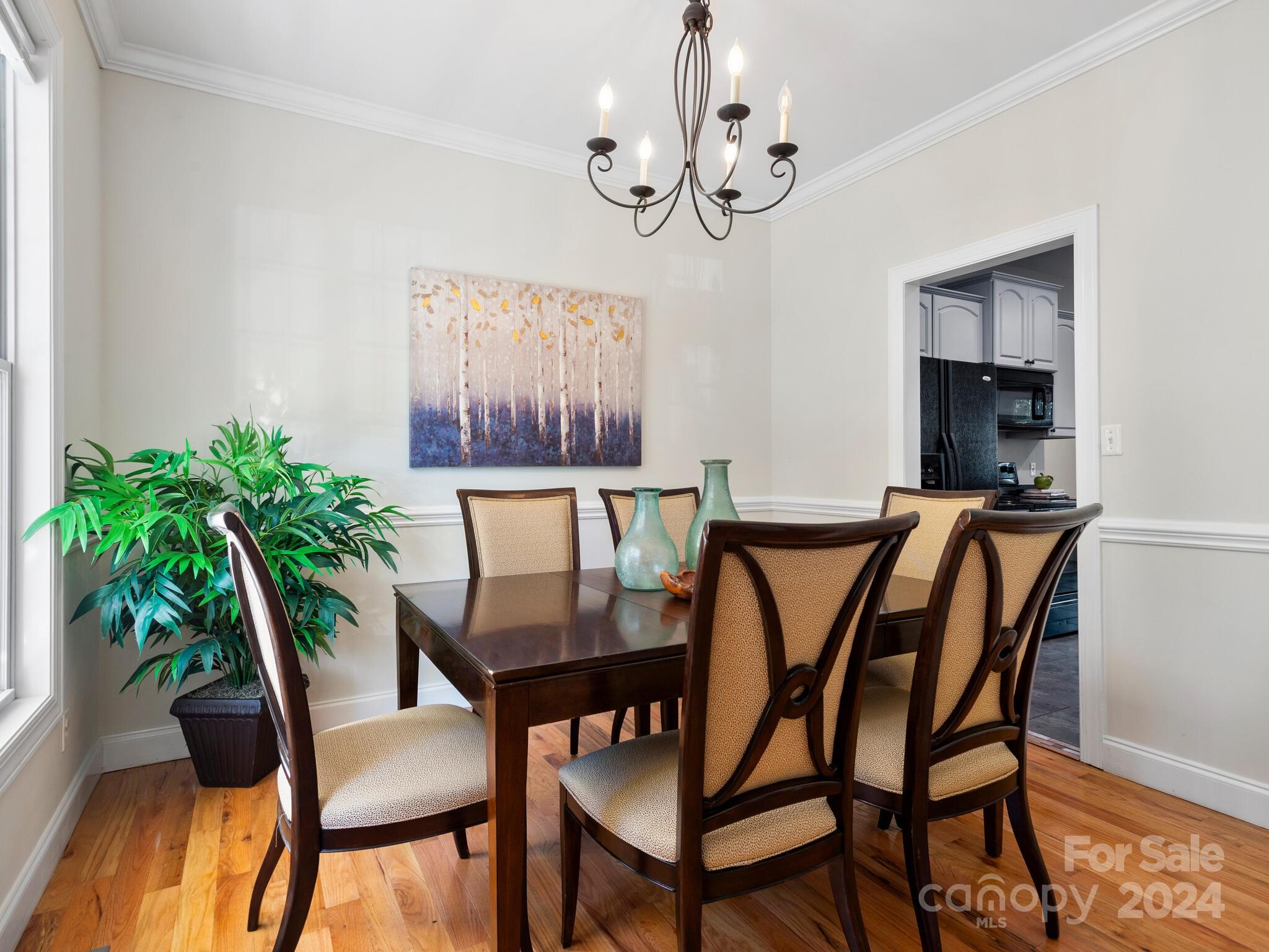 9 Forest Spring Drive Asheville, NC 28804 - Photo 19 of 42 a view of a dining room with furniture and wooden floor